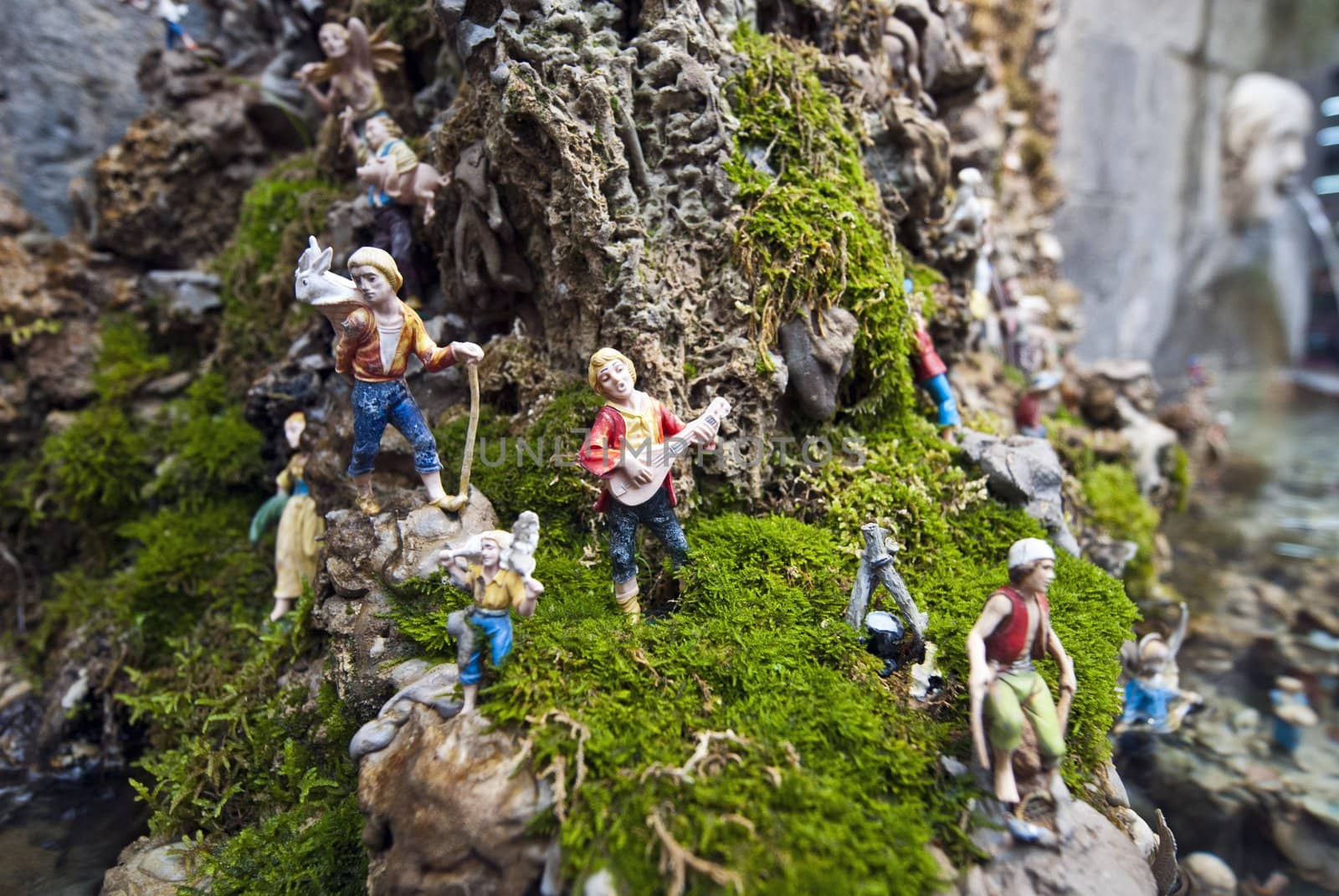small toy model men on a rock amalfi italy by itsrich
