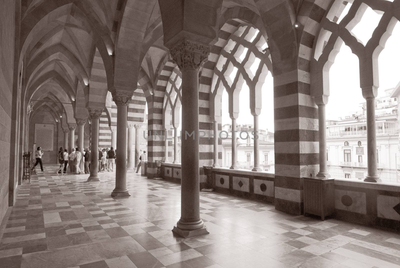 patterned architecture columns and floor amalfi, italy with tour group in background by itsrich