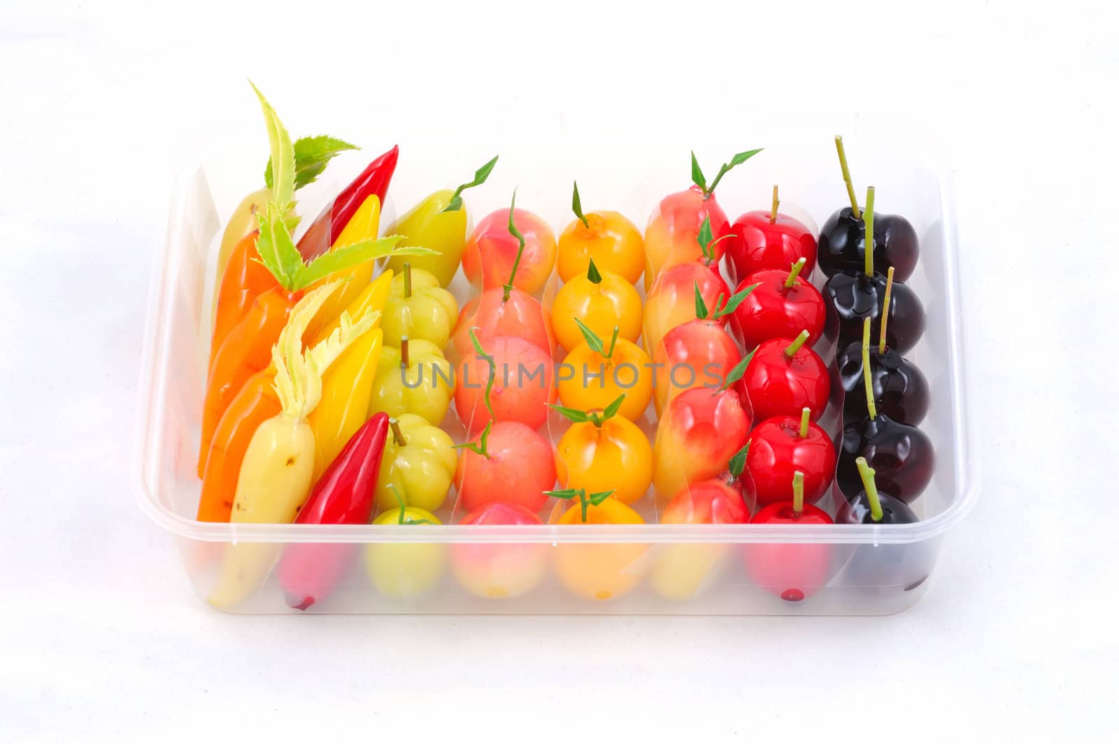 Thai dessert in plastic tray on white background.