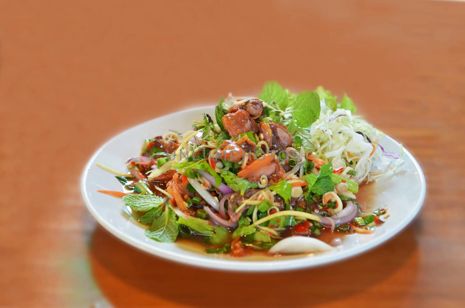 Spicy cockle salad served with fresh vegetable , Thai style seafood