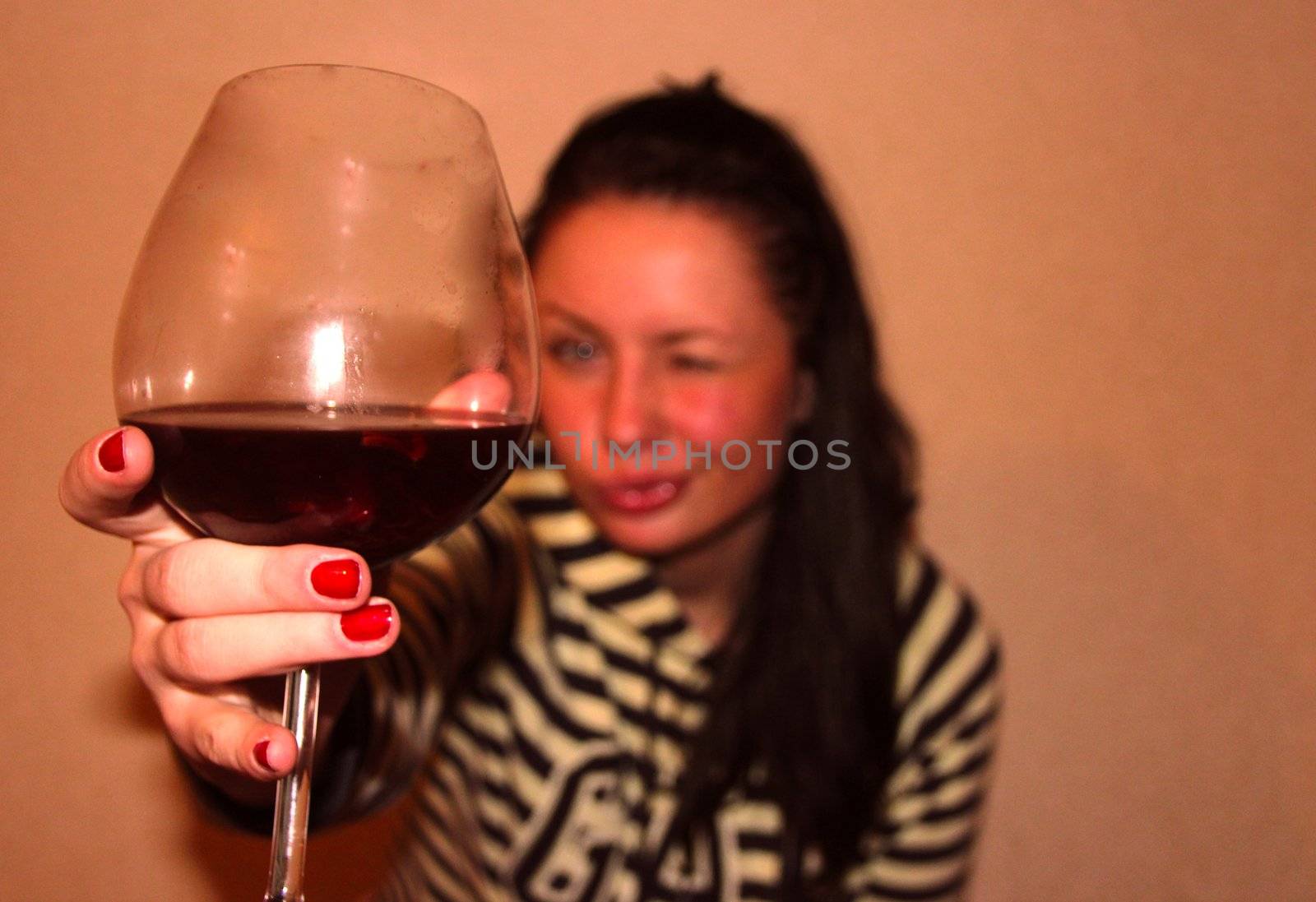 A young woman with a glass of red wine by Metanna