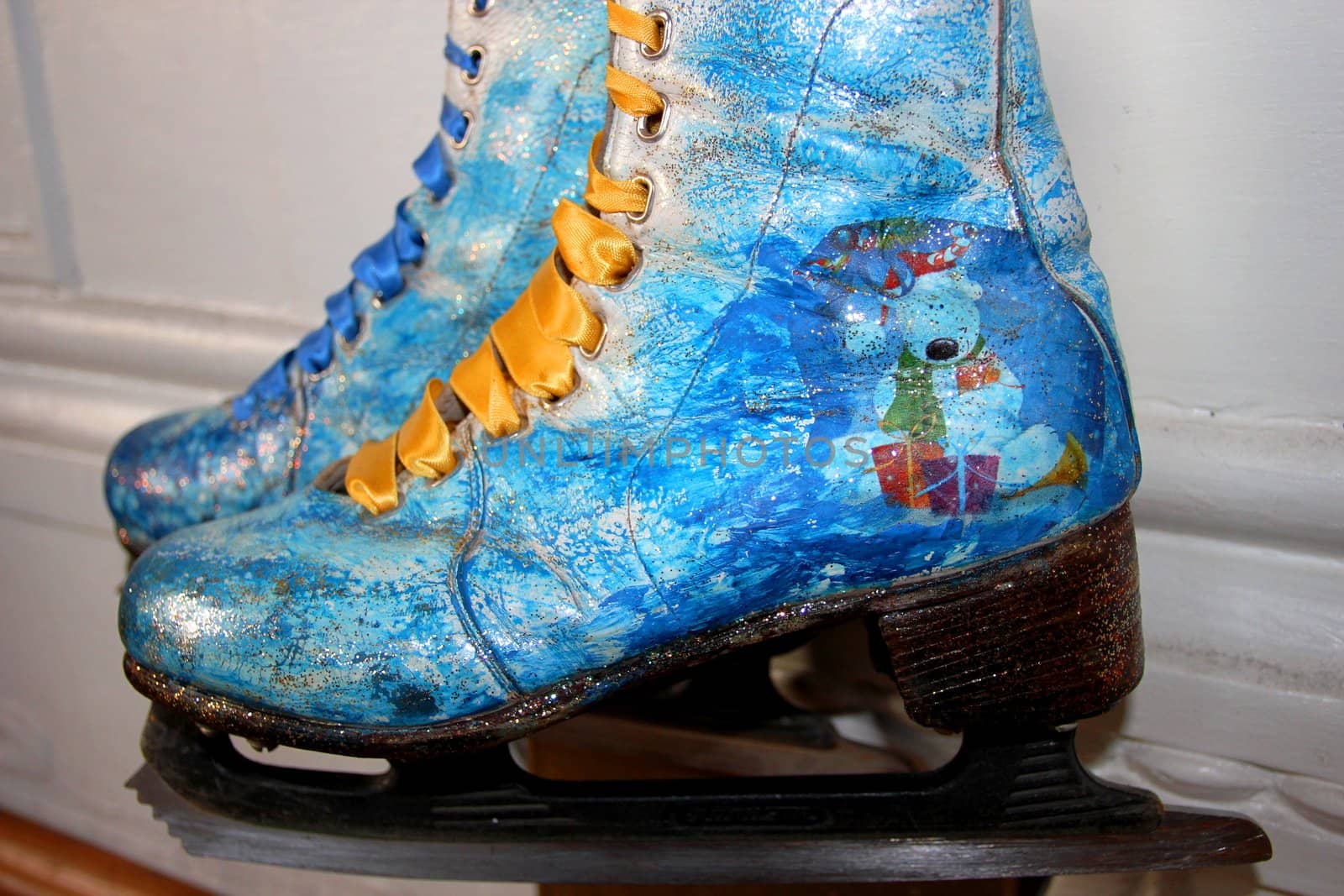 Beautiful ancient skates painted under winter subjects