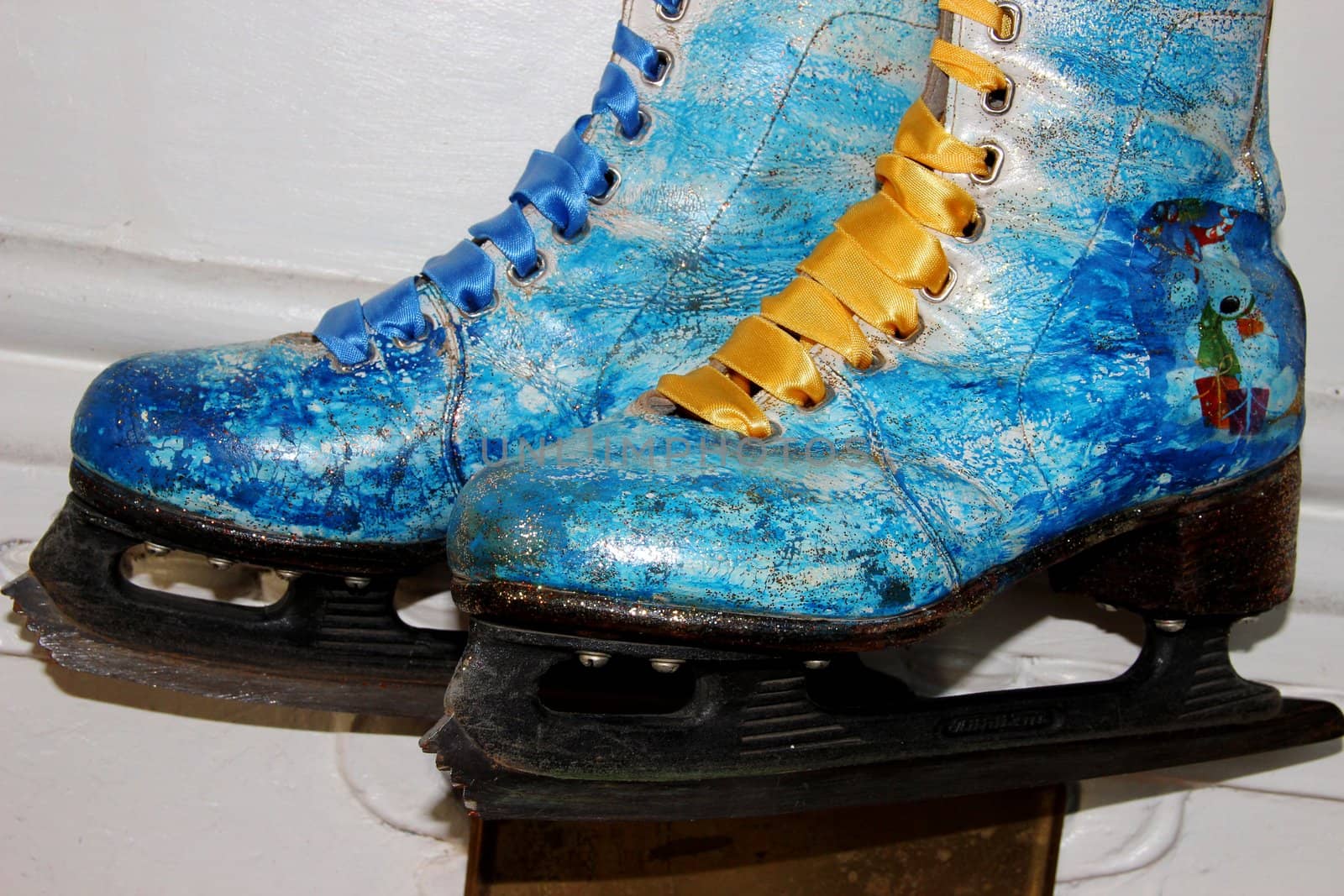 Beautiful ancient skates painted under winter subjects