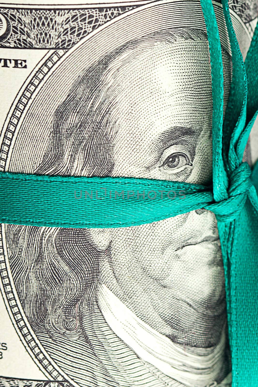 Dollars rolled into a tube tied with ribbon by jannyjus