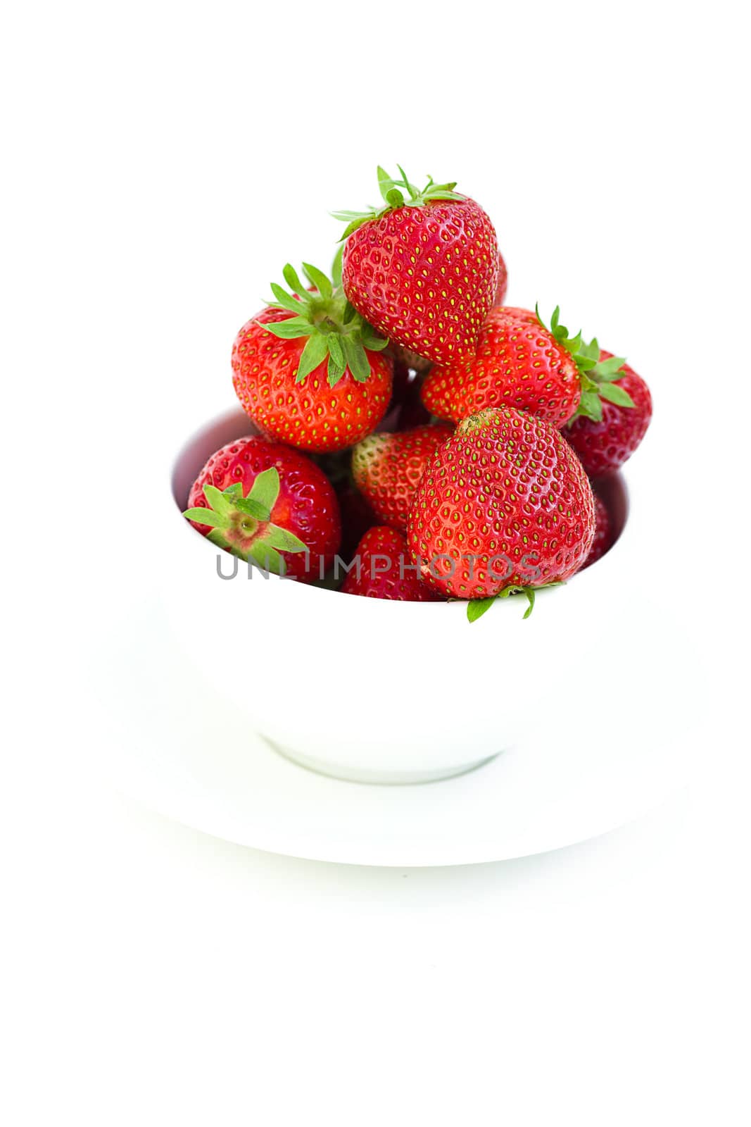 strawberries in a bowl in the daylight by jannyjus