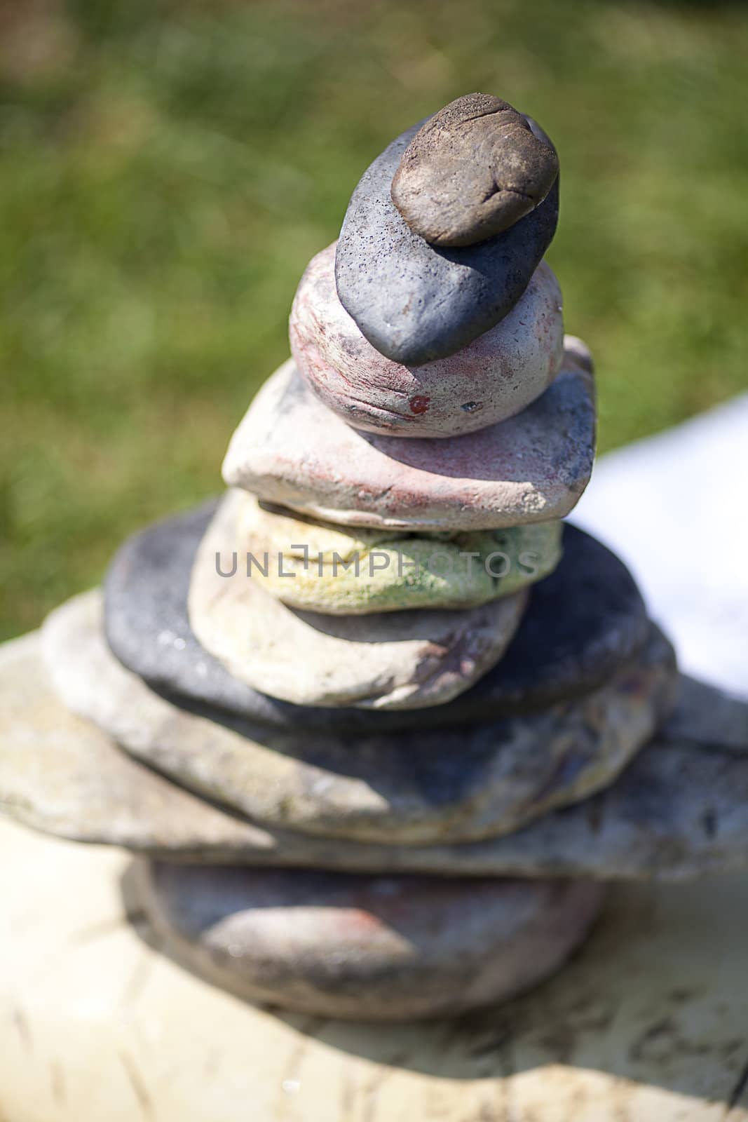 stones piled on each other against the background of grass