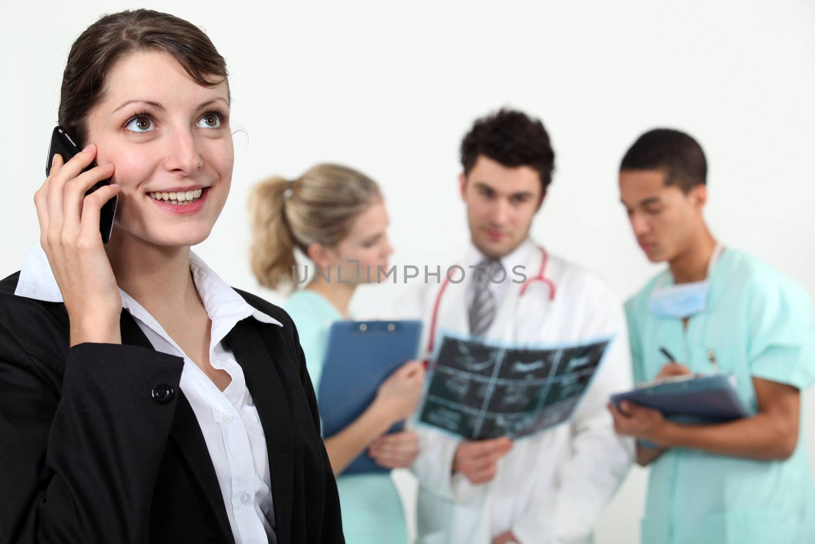 businesswoman in a hospital talking on her cell