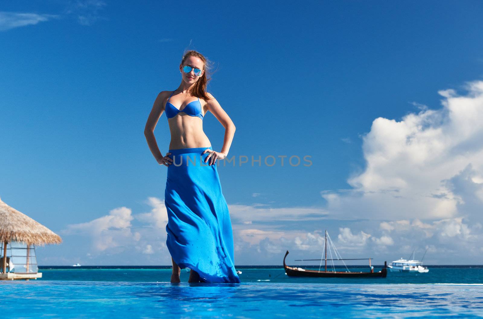 Woman in skirt at the pool 