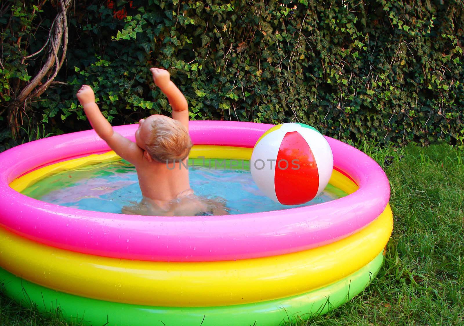 The kid in an inflatable pool