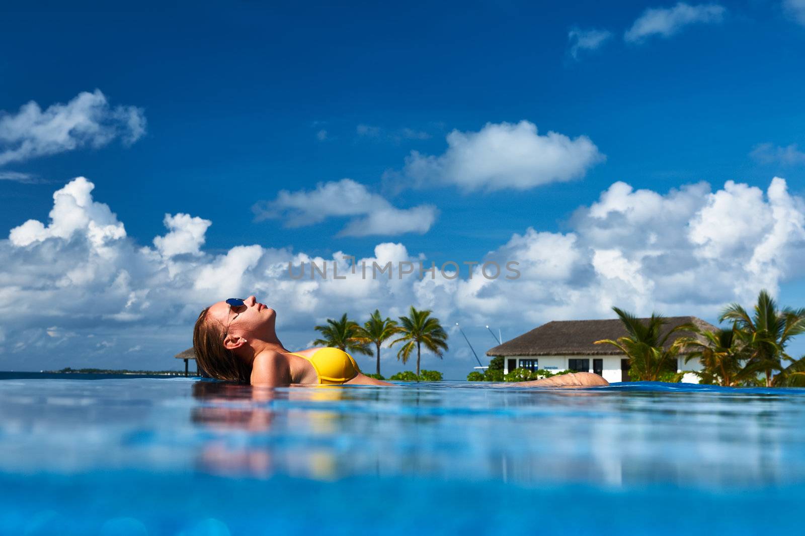 Woman at poolside by haveseen