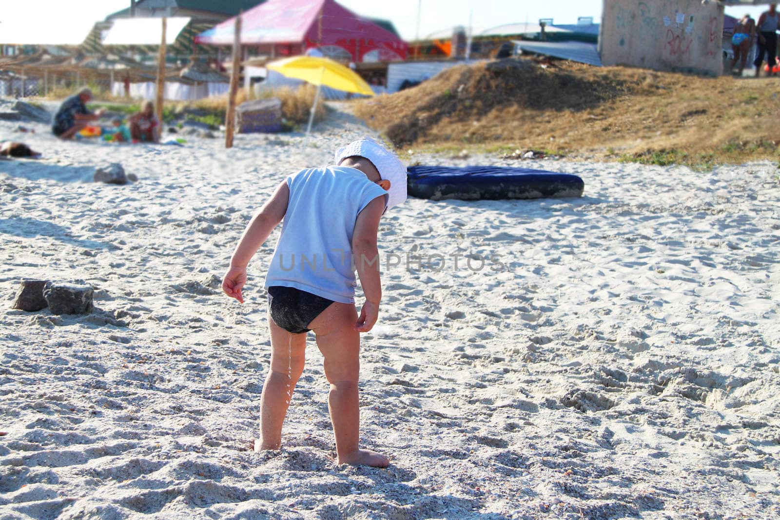 The kid on the beach did not have time in the toilet