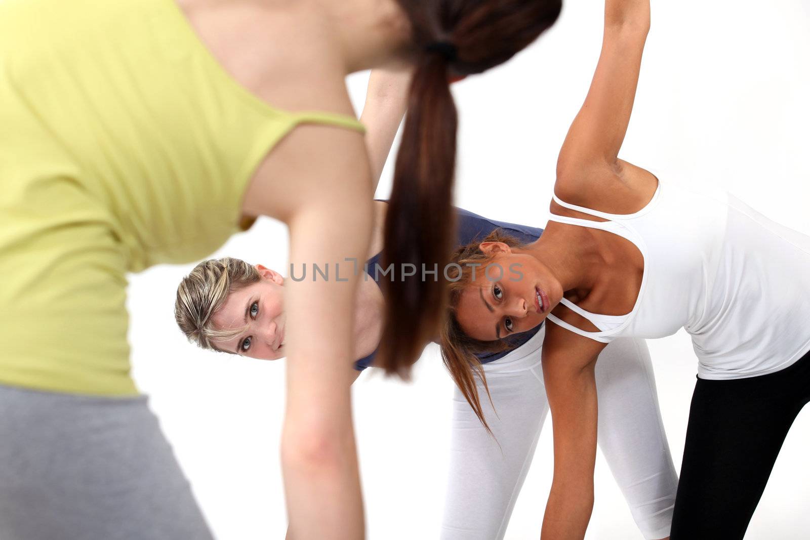 Young women in a fitness class by phovoir