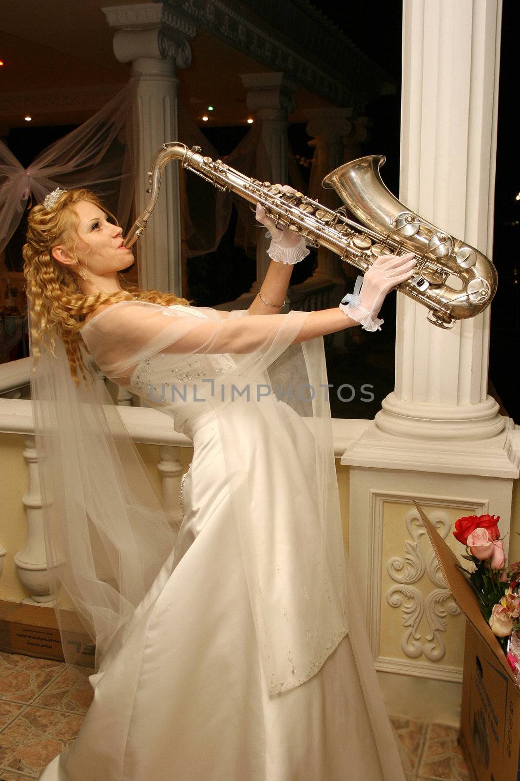 Bride plays the saxophone