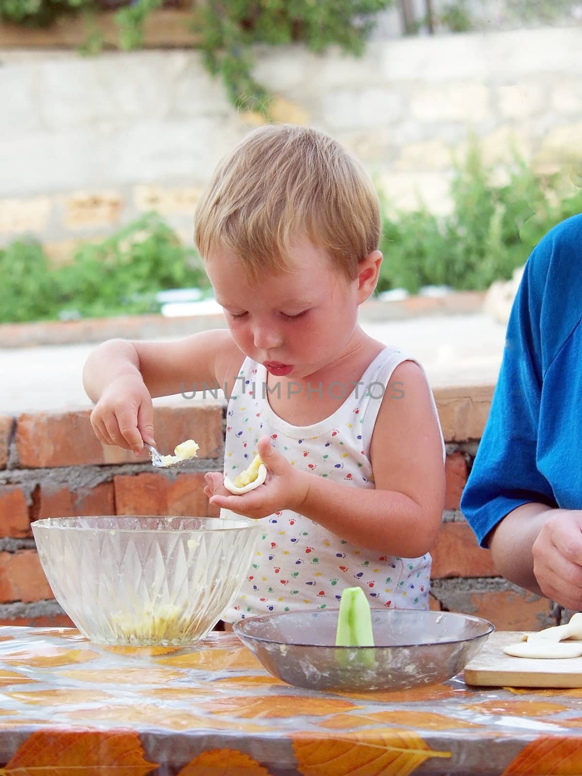 Baby sculpts dumplings