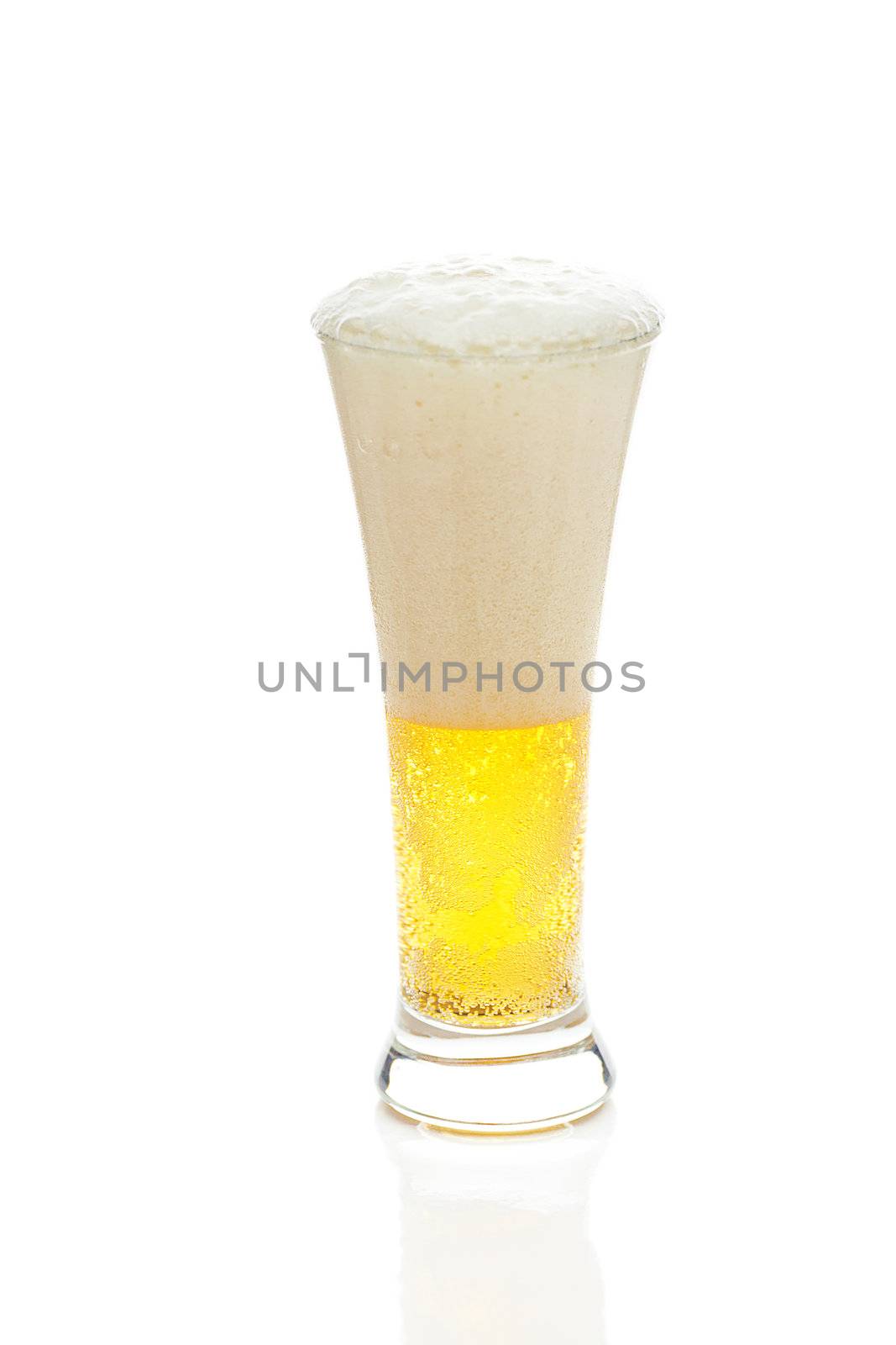 light beer with the foam in a tall glass isolated on white by jannyjus