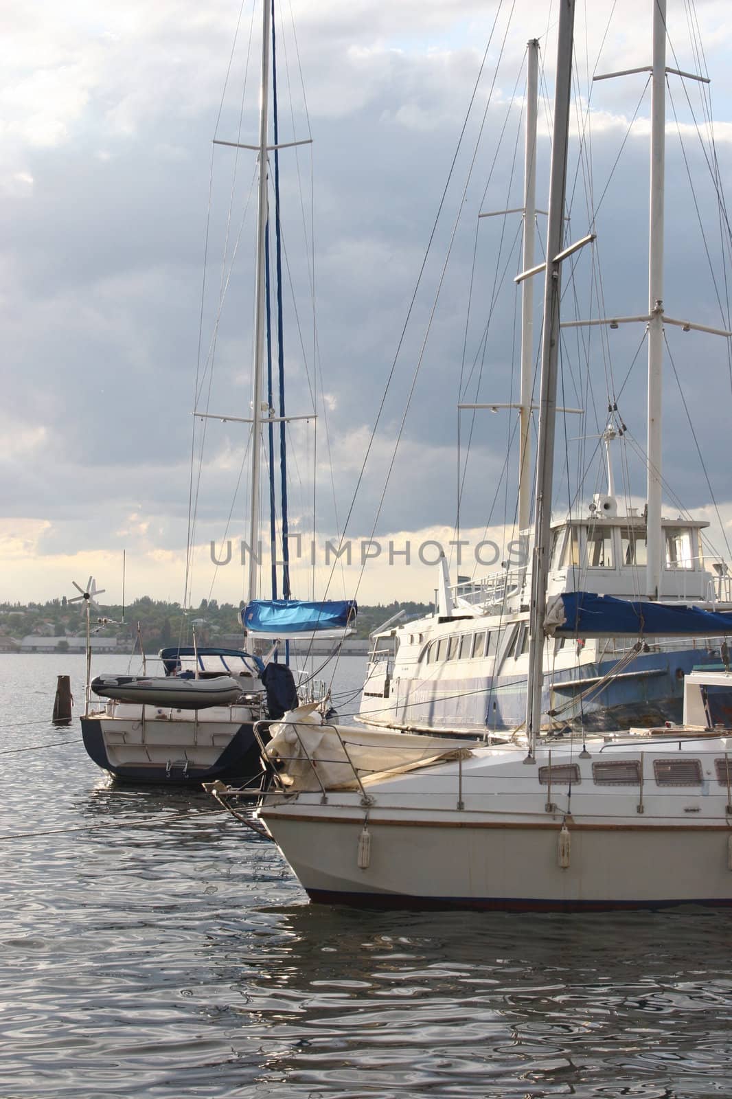 Yachts and boats at the pier. Evening Landscape.