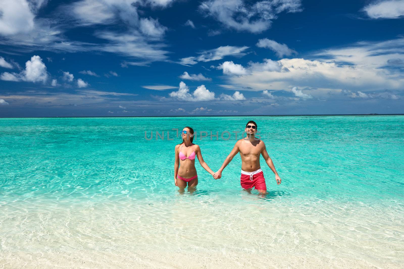 Couple on a tropical beach at Maldives