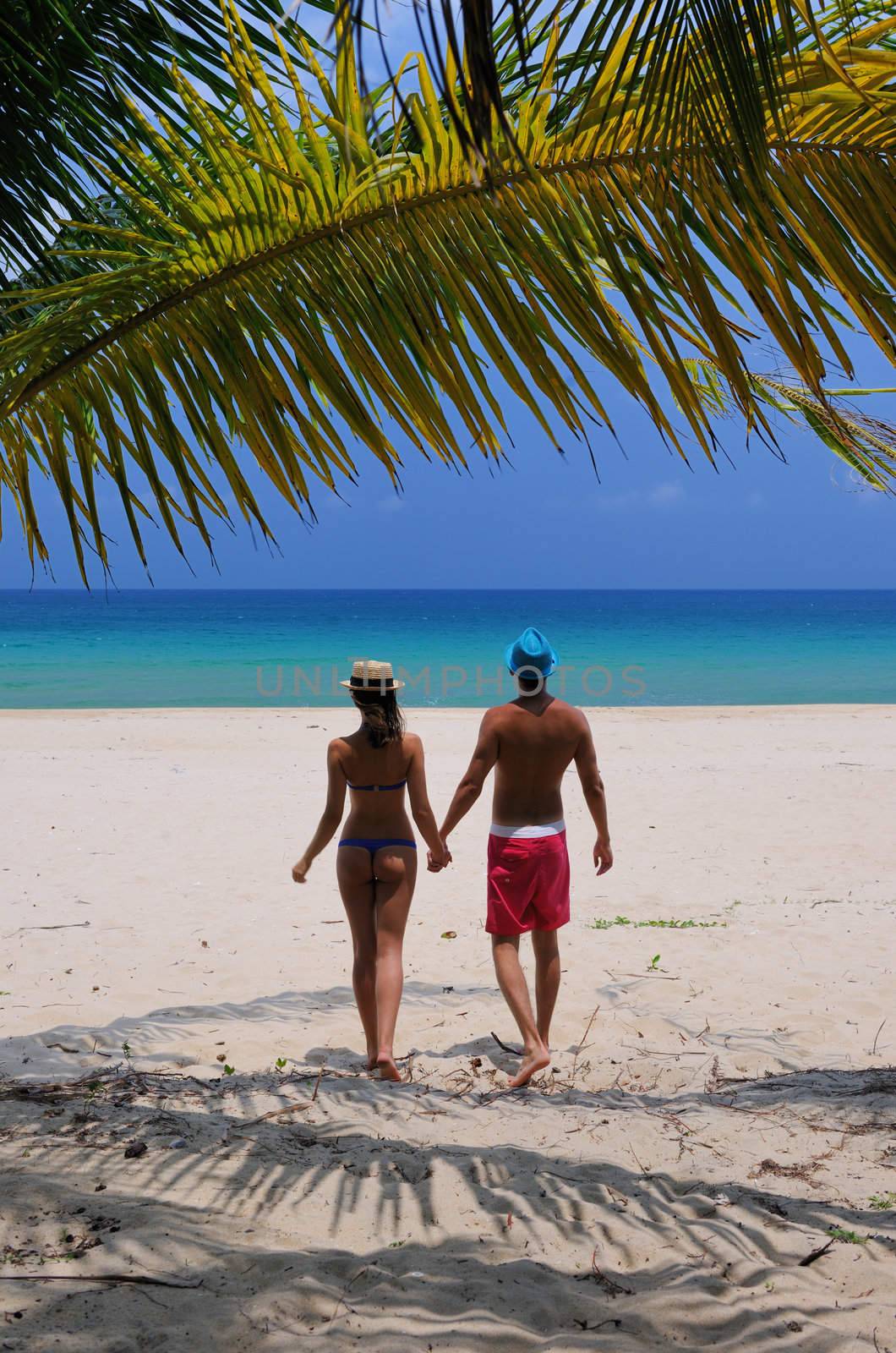 Couple on a beach by haveseen