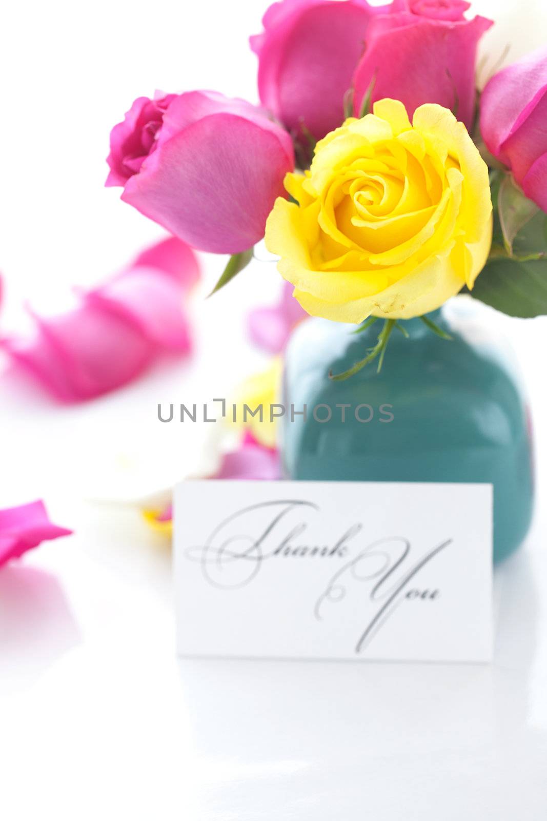 bouquet of colorful roses in vase,petals and card with the words by jannyjus