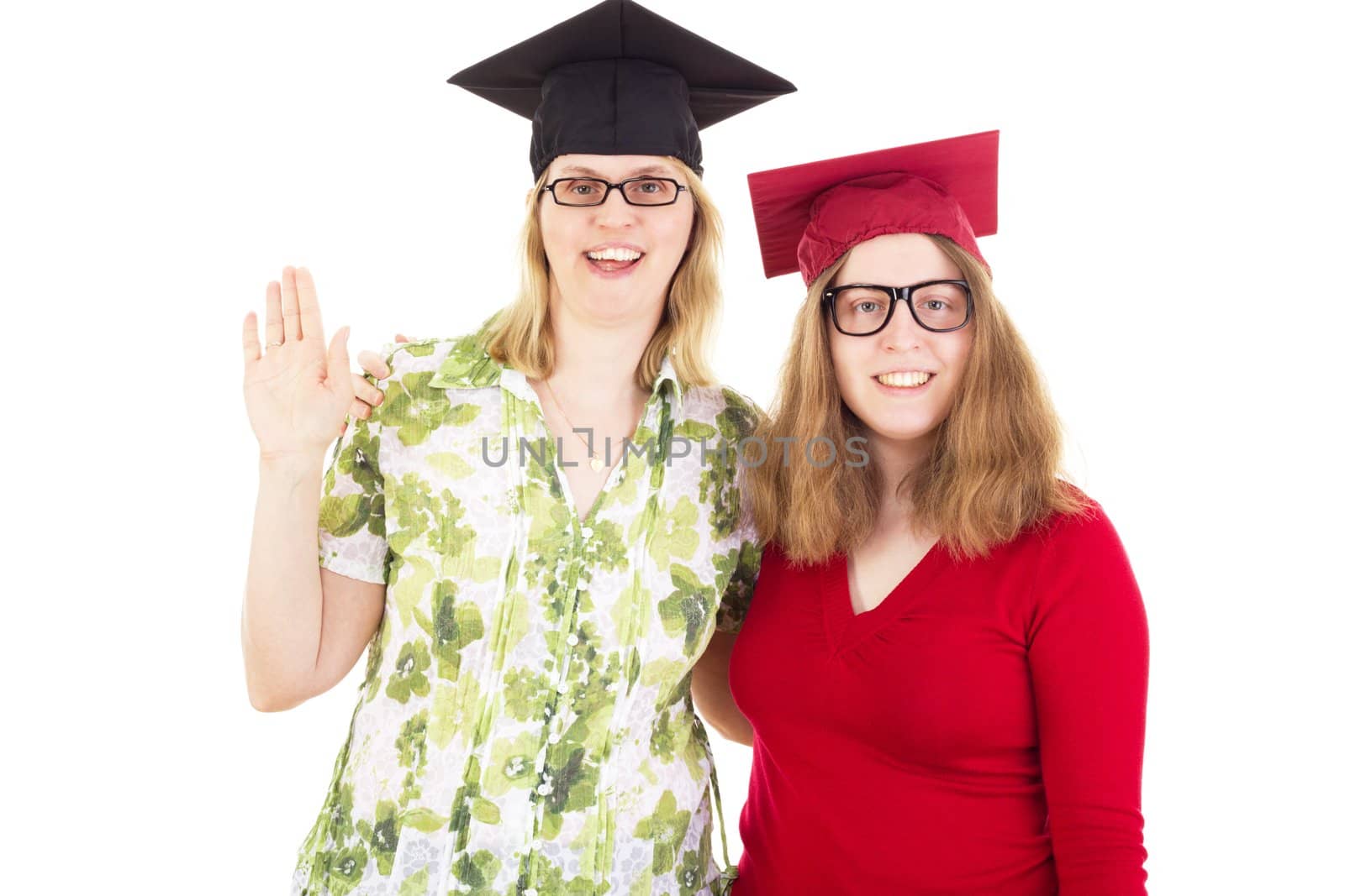 Two happy female graduates by gwolters