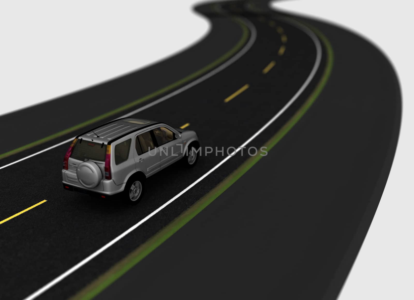 white modern car on the winding asphaltic road