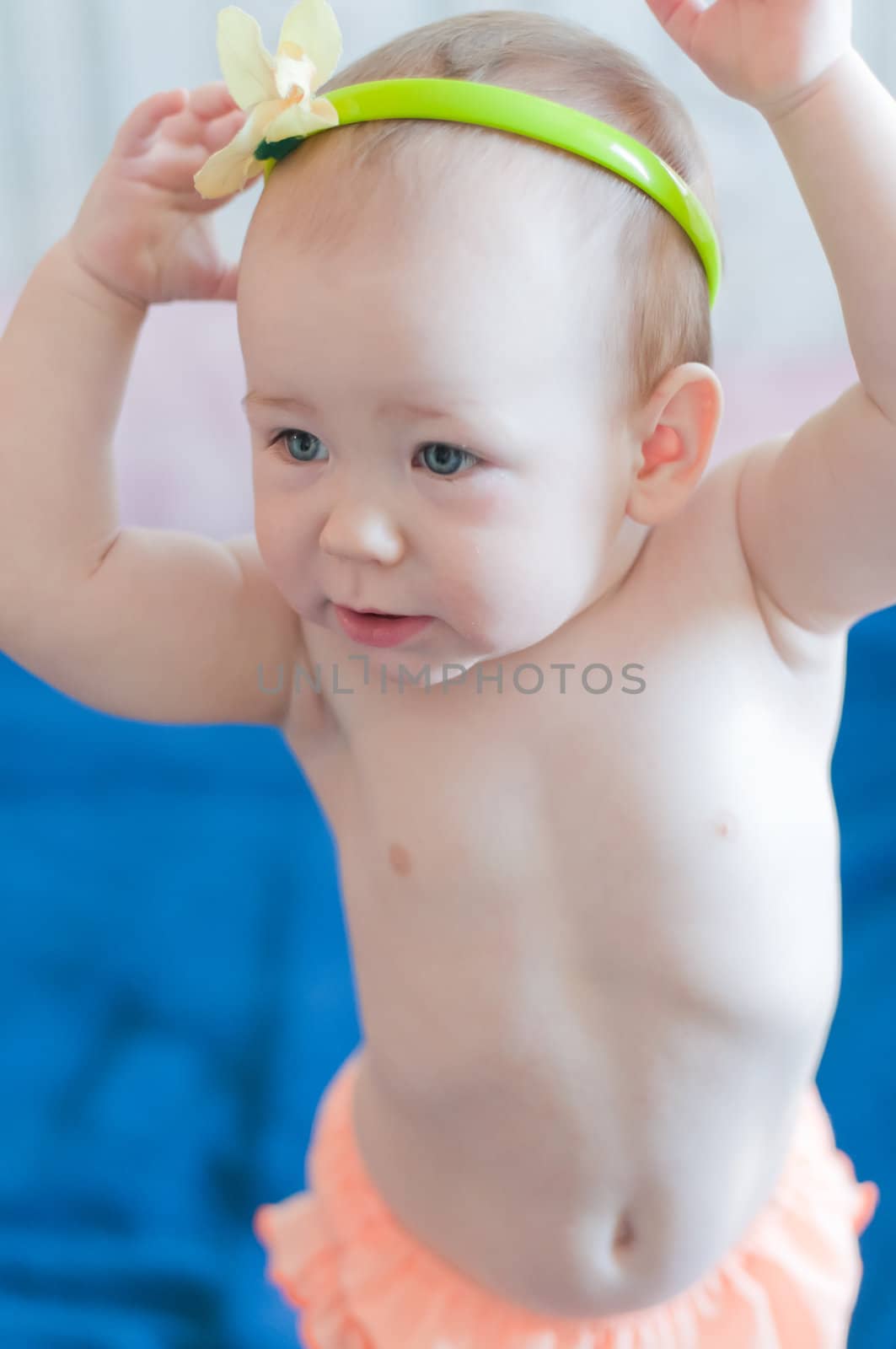 Little girl wears her headband