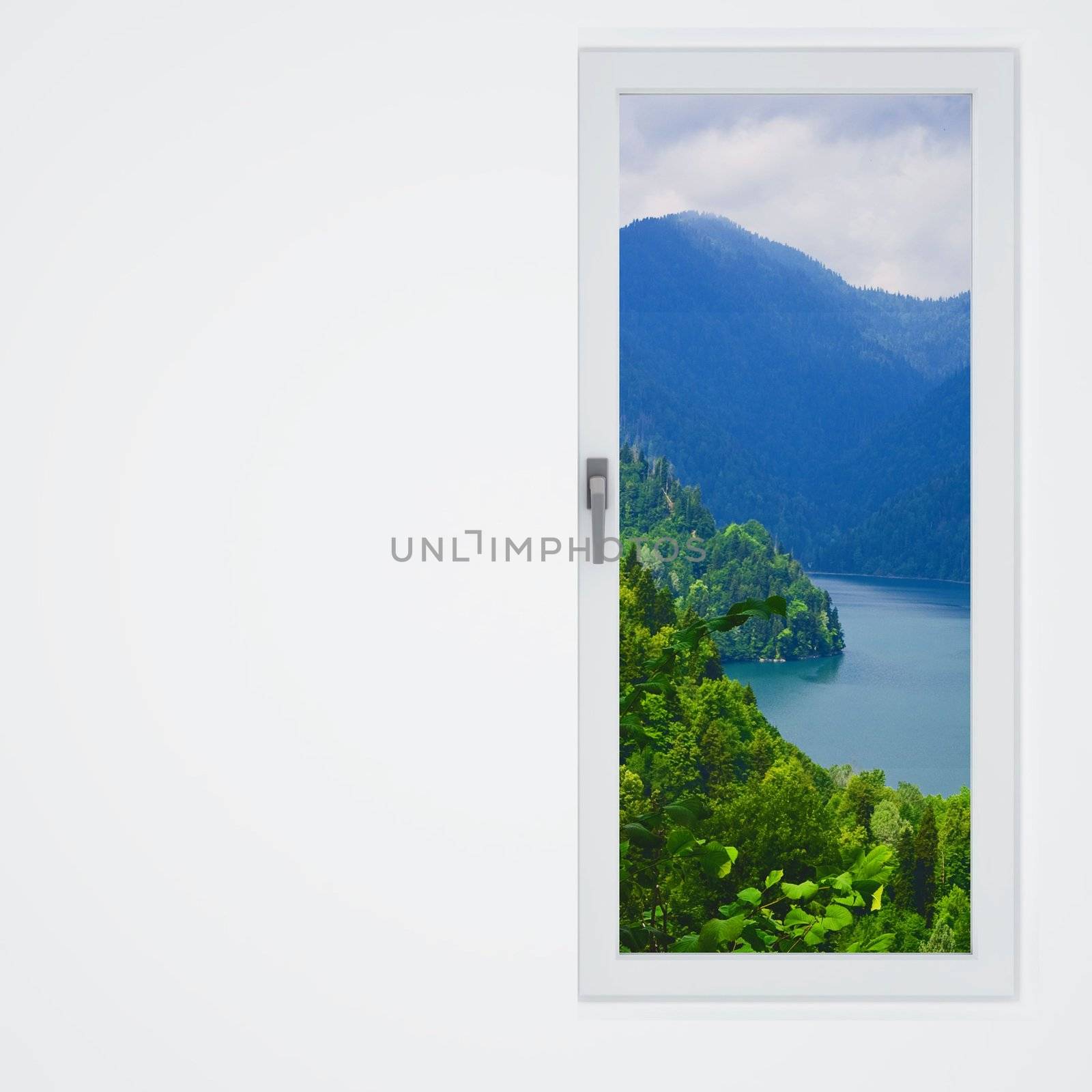 white wall and window with a beautiful view on mountains and lake