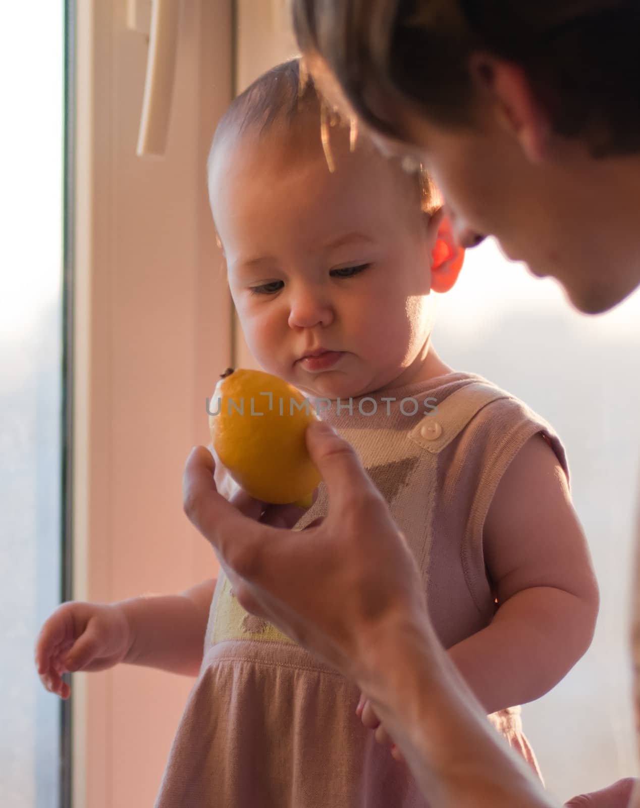 Father gives his daughter lemon