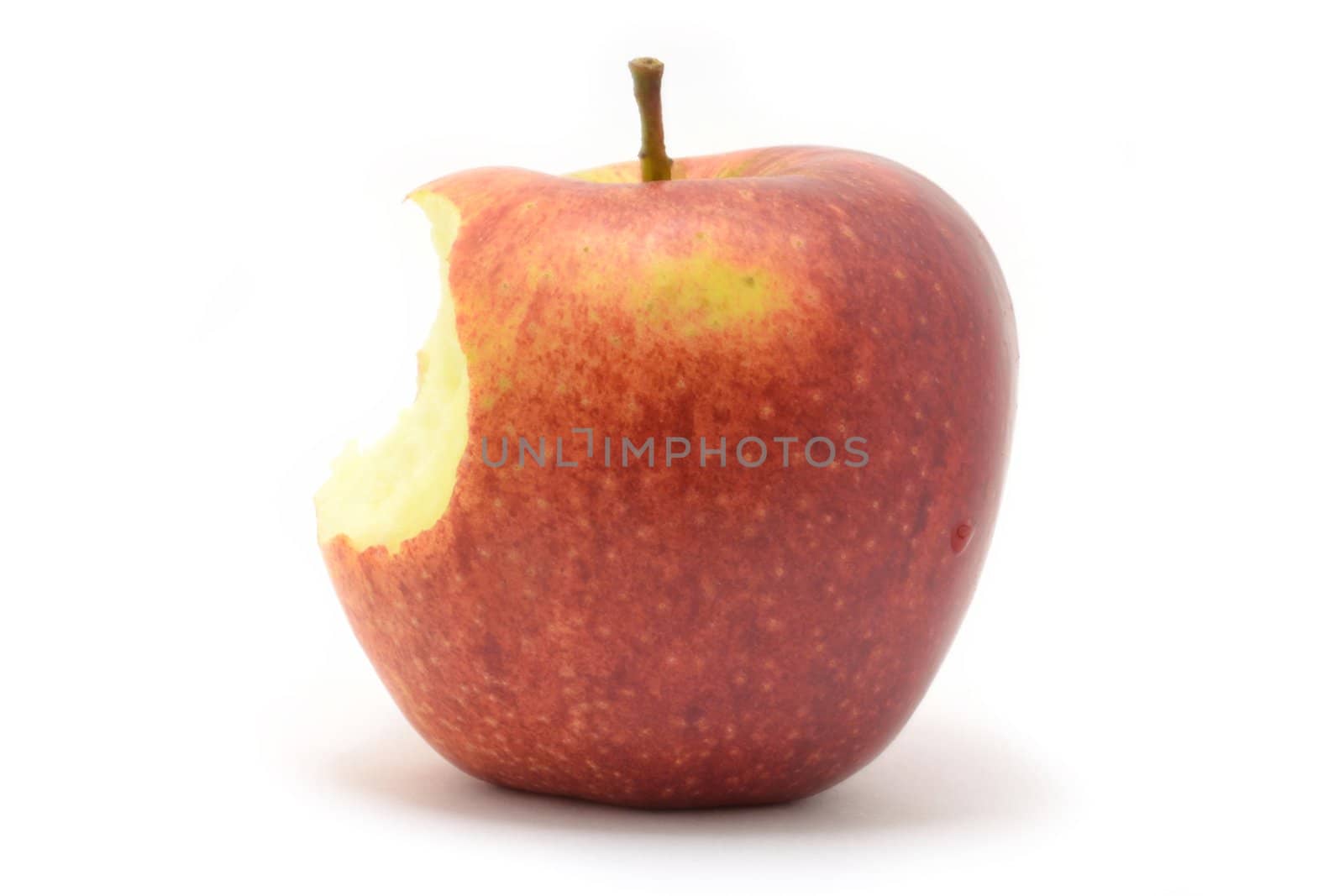 Bitten off apple over white background