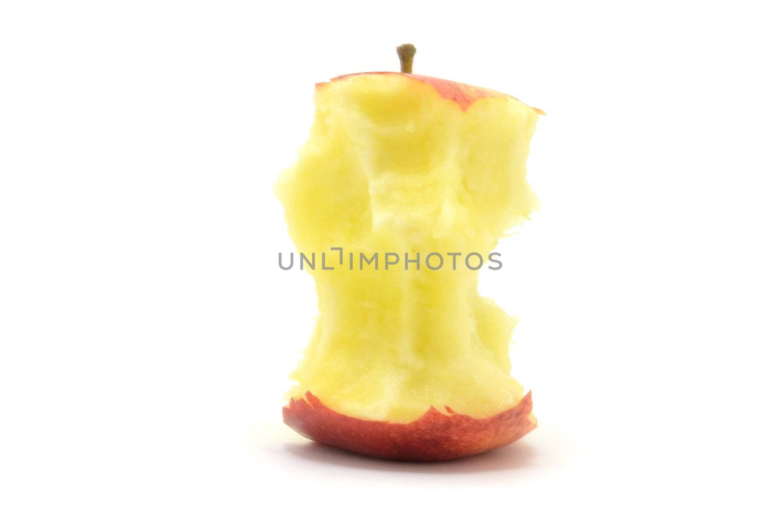 Red apple stump over white background