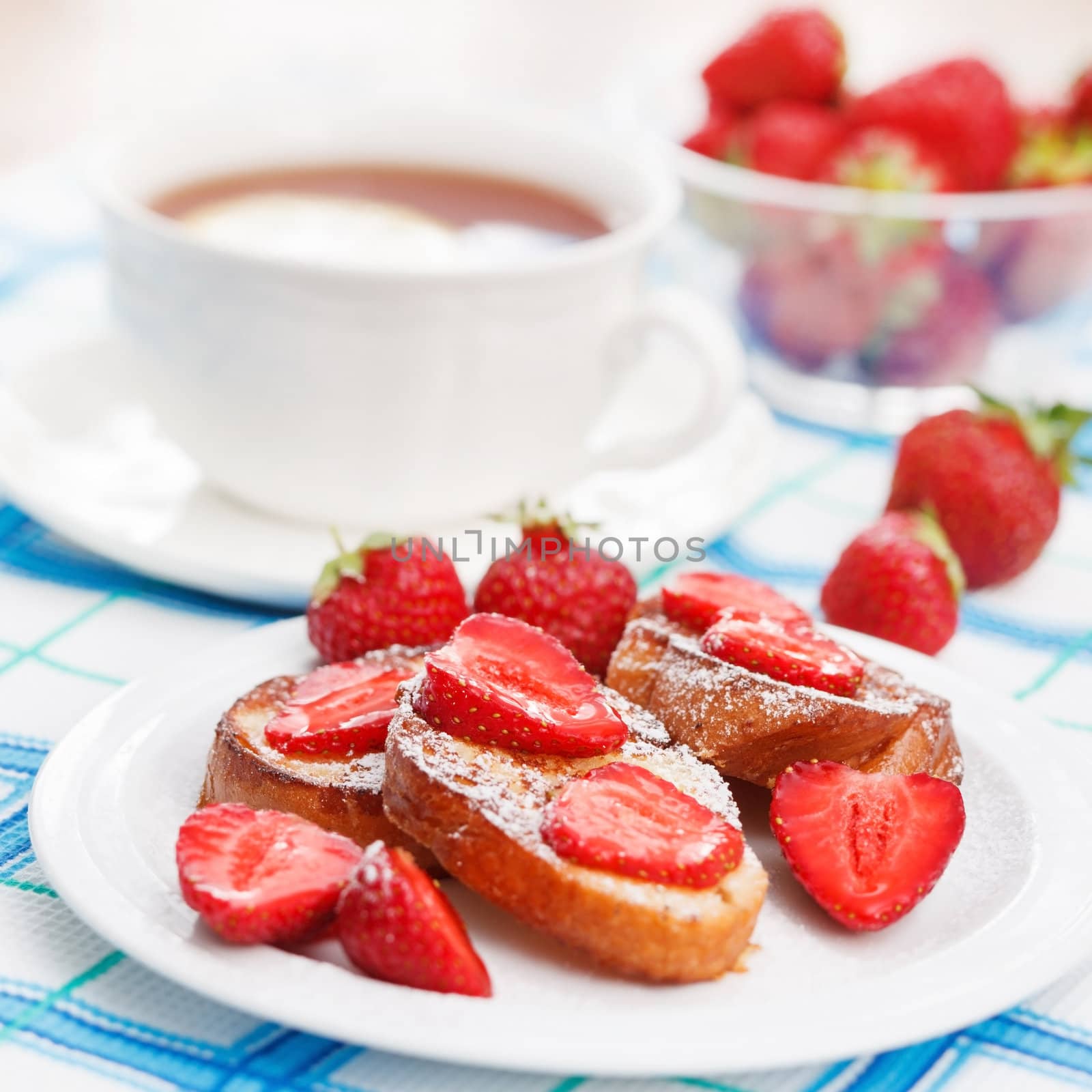 French toasts with powdered sugar and a strawberry by shebeko