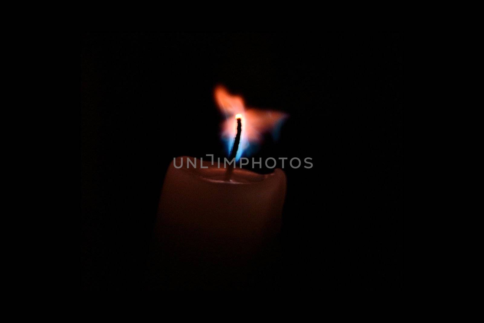 The candle flares by Autre