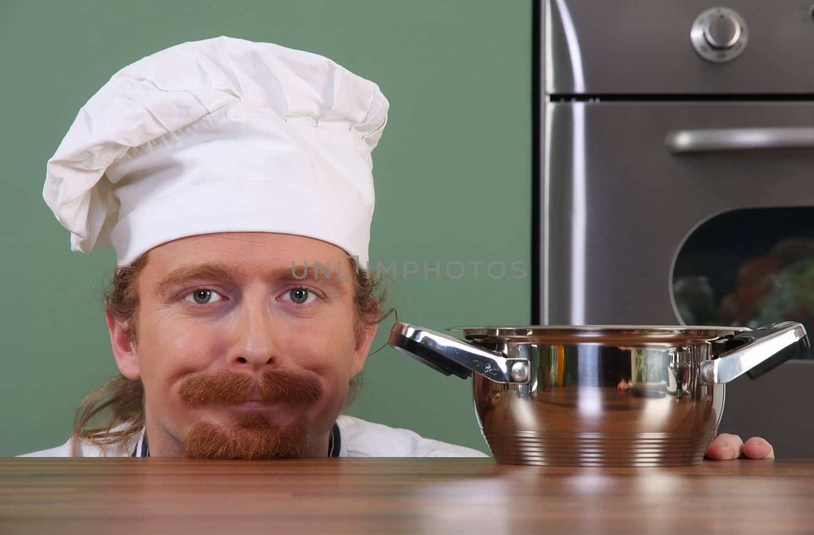 Funny young chef with a pot by vladacanon