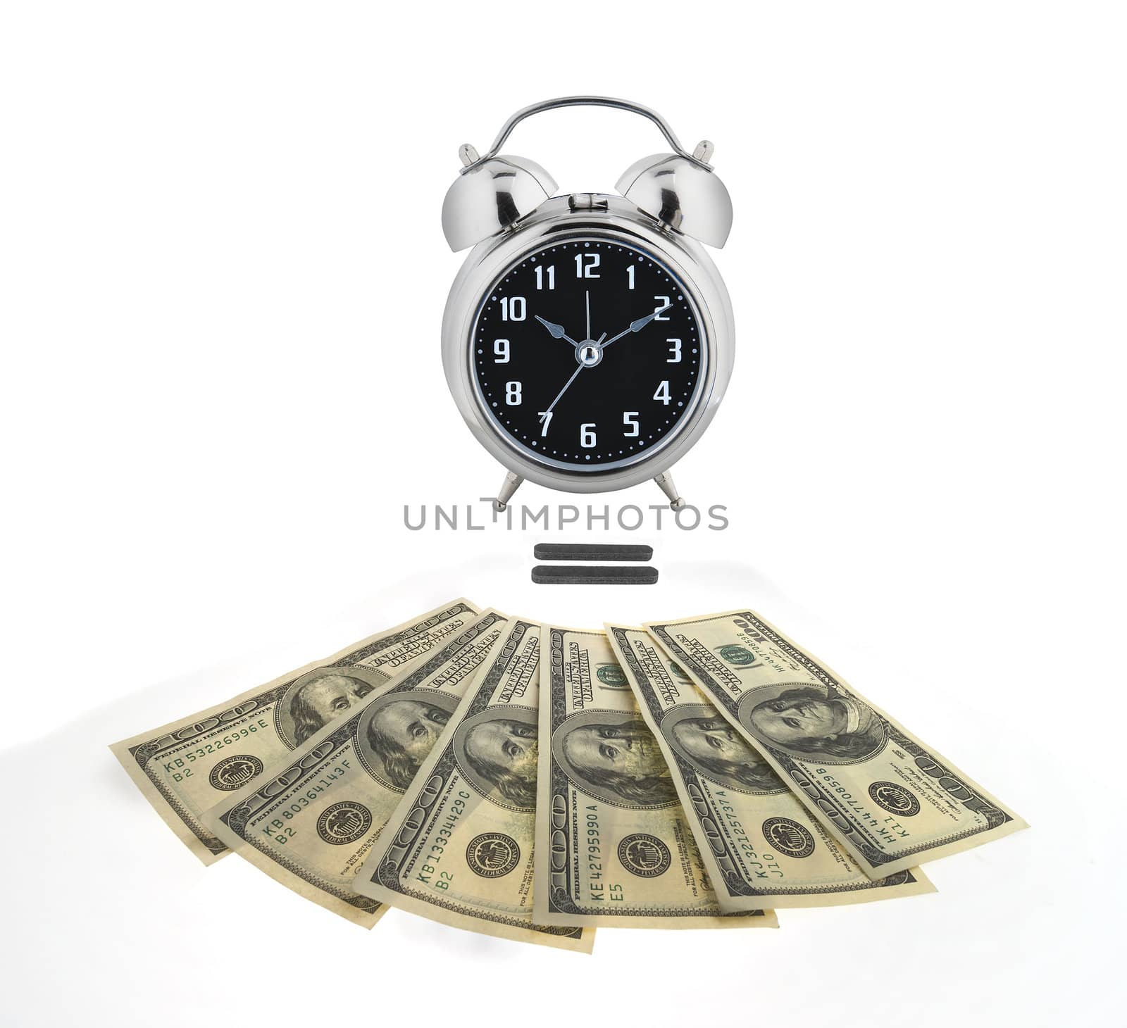 Old alarm clock over money to illustrate the concept, " time is money."