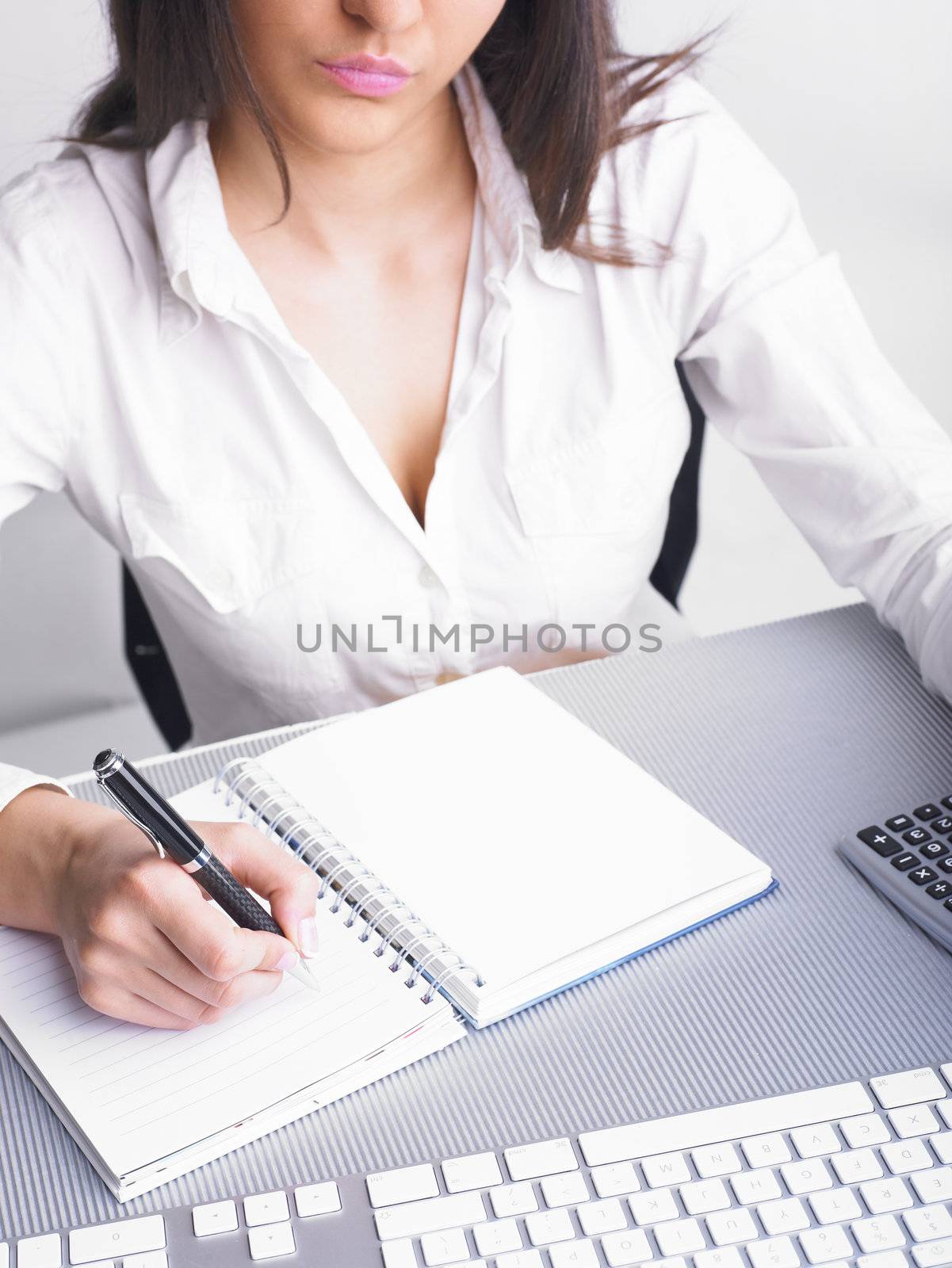 Office Assistant in white writing Schedule