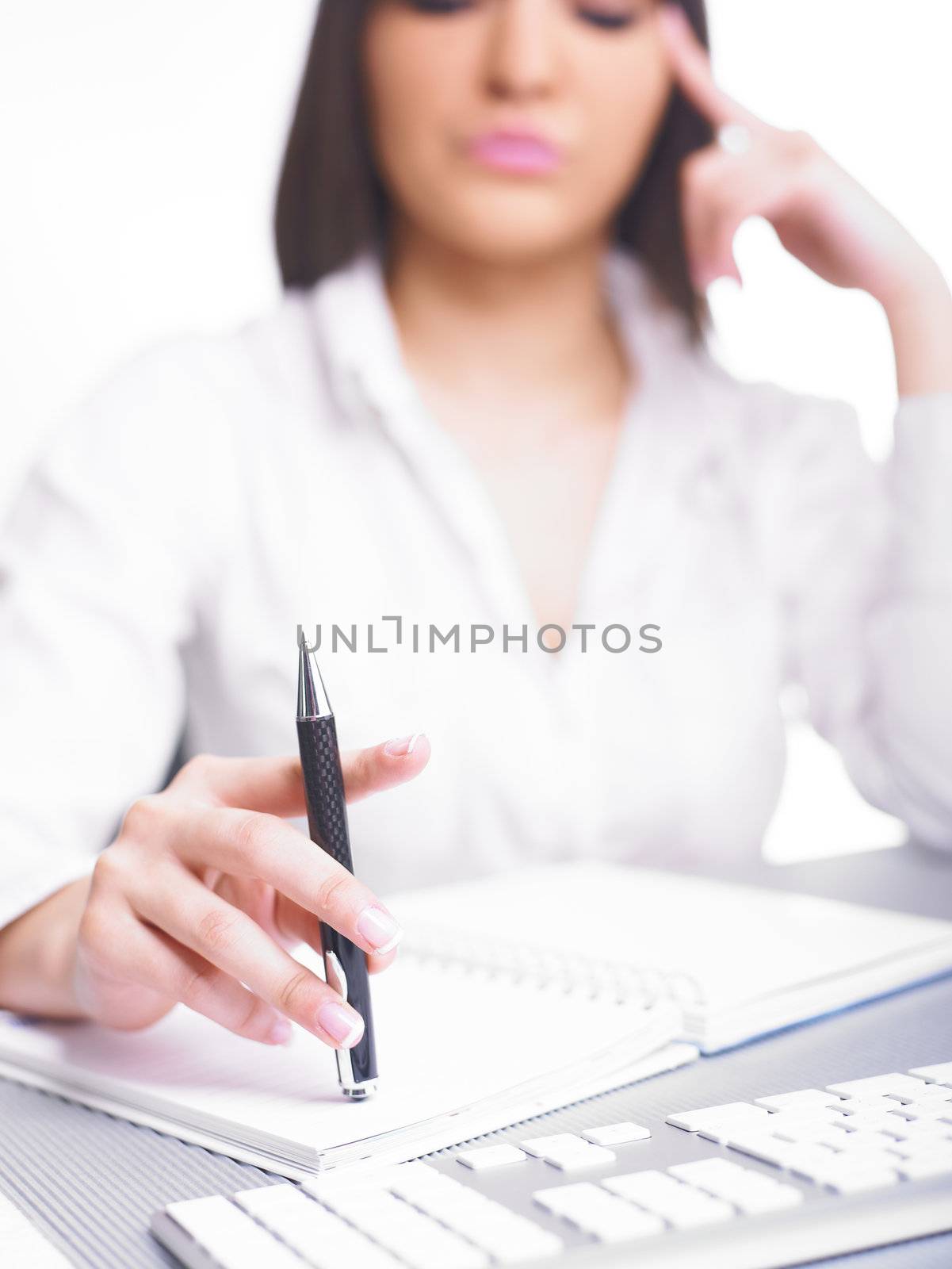 Happy Business Woman Writing in notepad