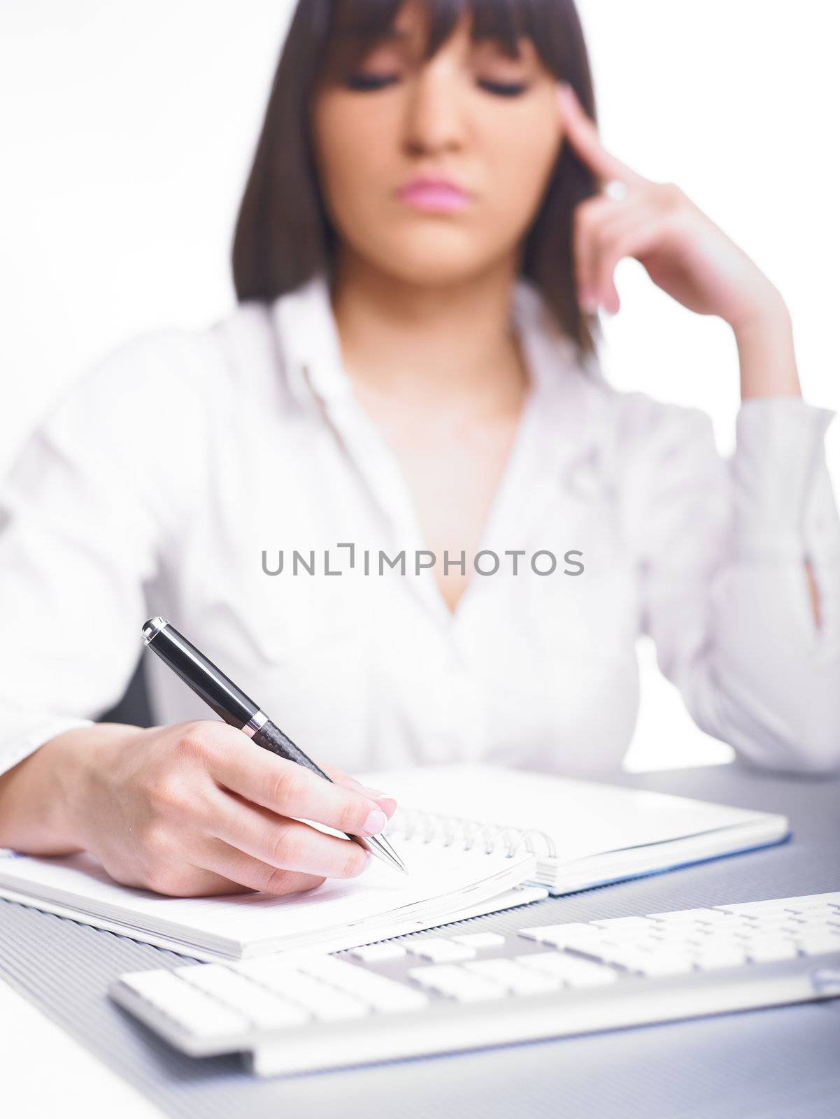 Happy Business Woman Writing in notepad