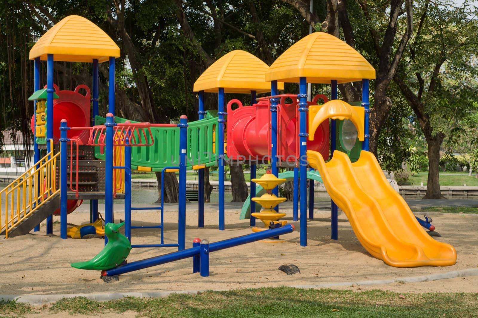 Colorful public plastic playground in garden