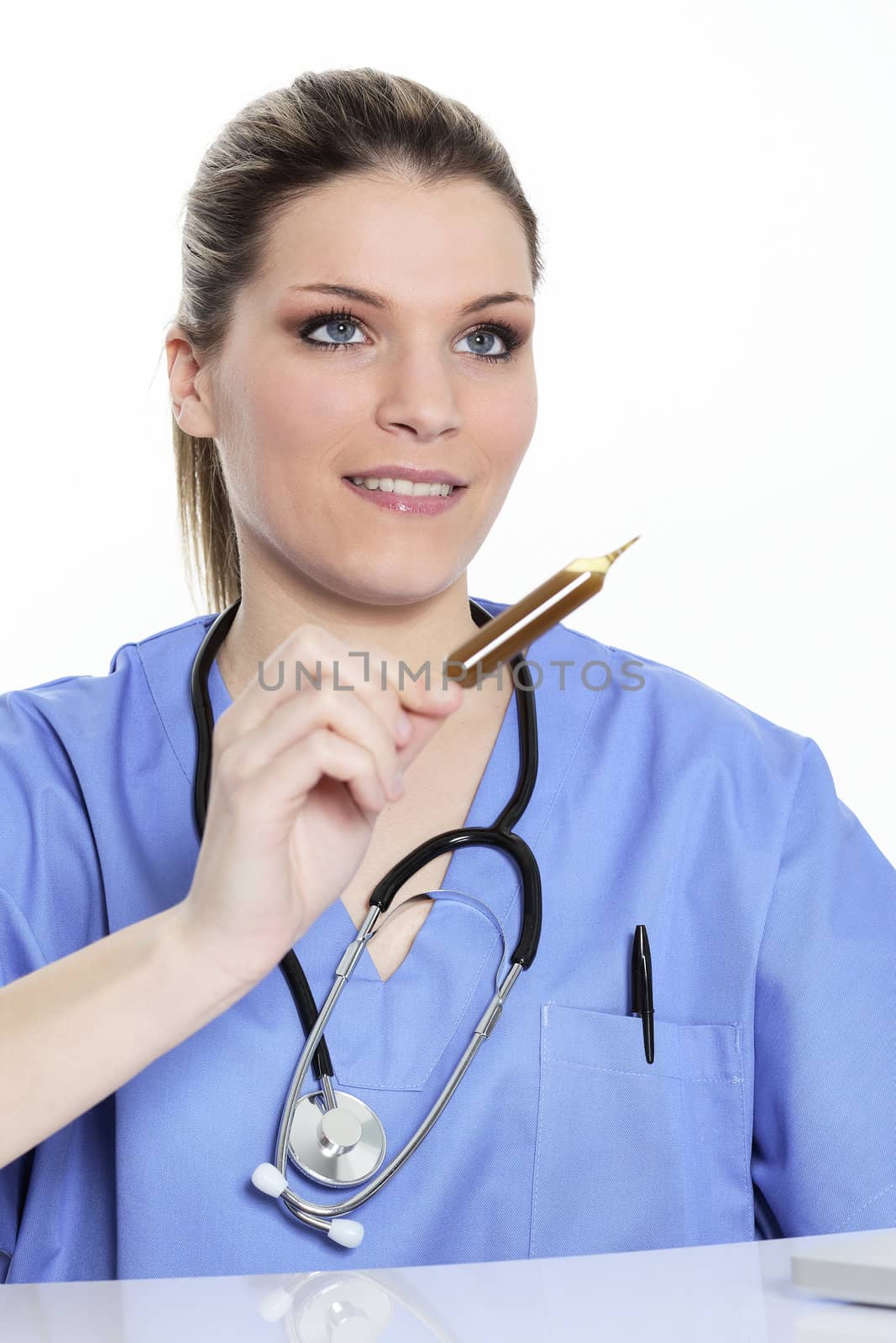 blond woman doctor looks at an ampoule with a medicine 