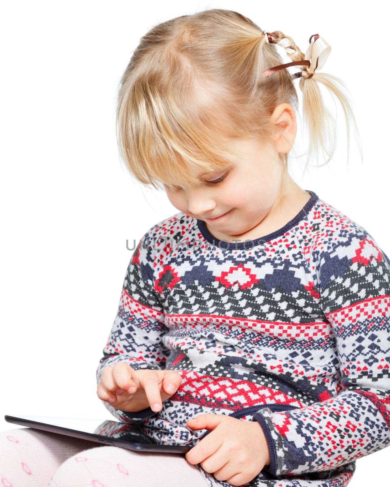 Portrait of 4 years girl using a touch pad