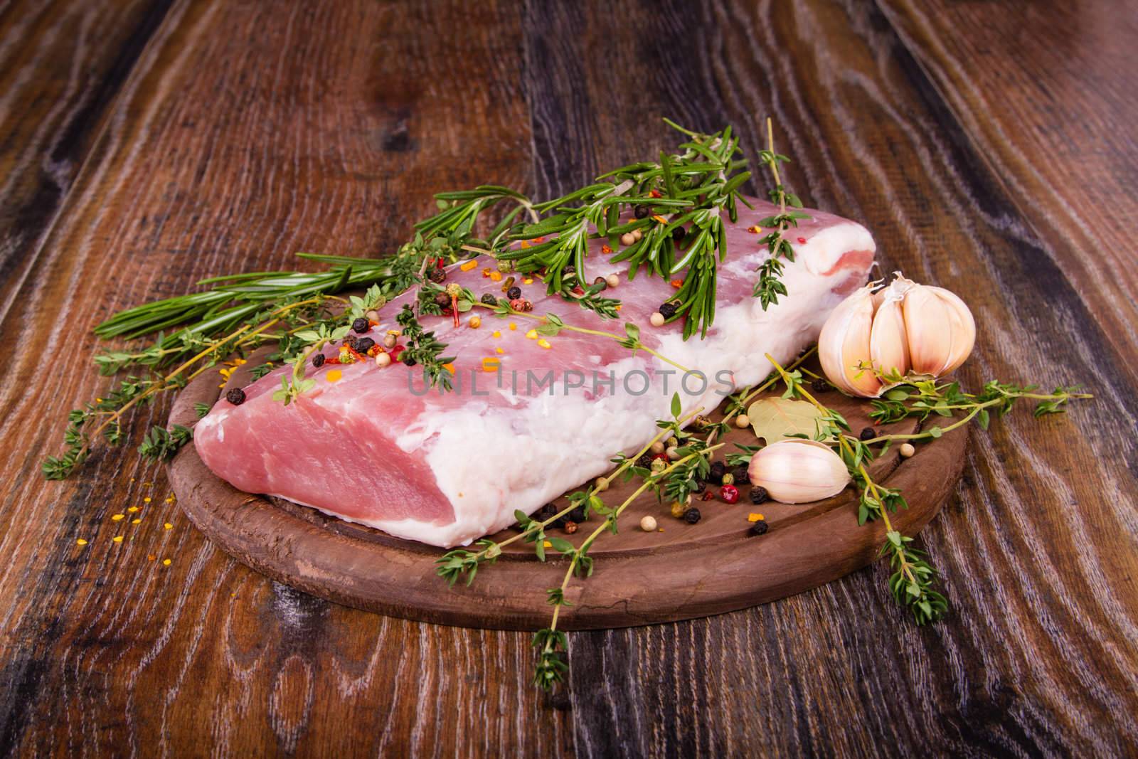 Raw fresh meat on cutting board with condiments on white background