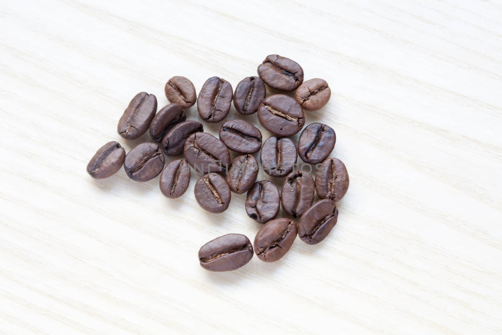 coffee beans on white wooden background by sfinks