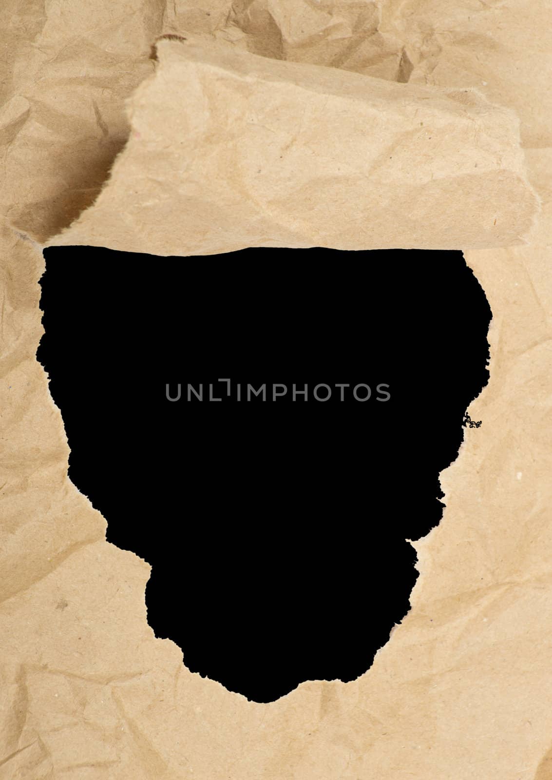 ripped white paper against a black background