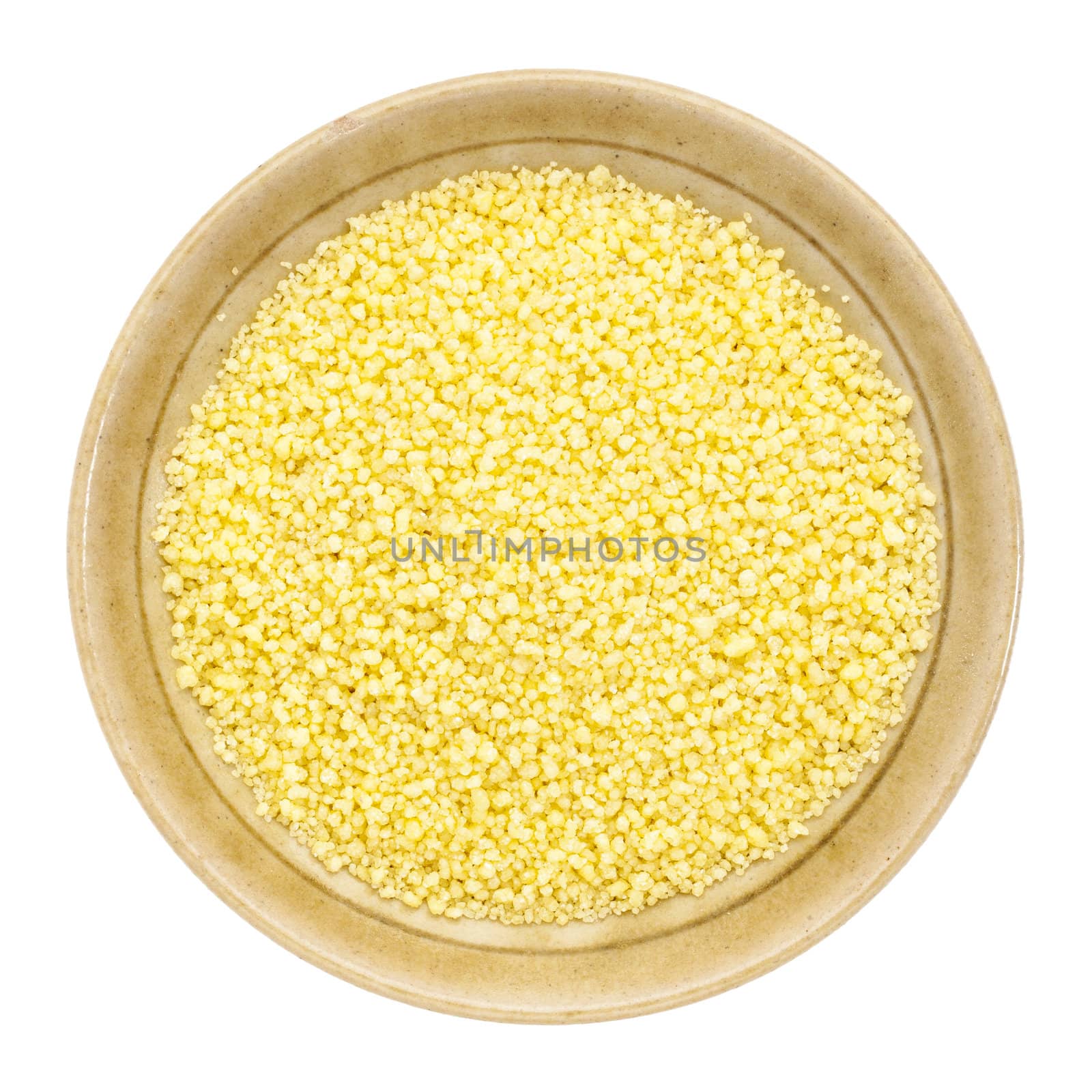 wheat couscous in a small ceramic bowl isolated on white, top view