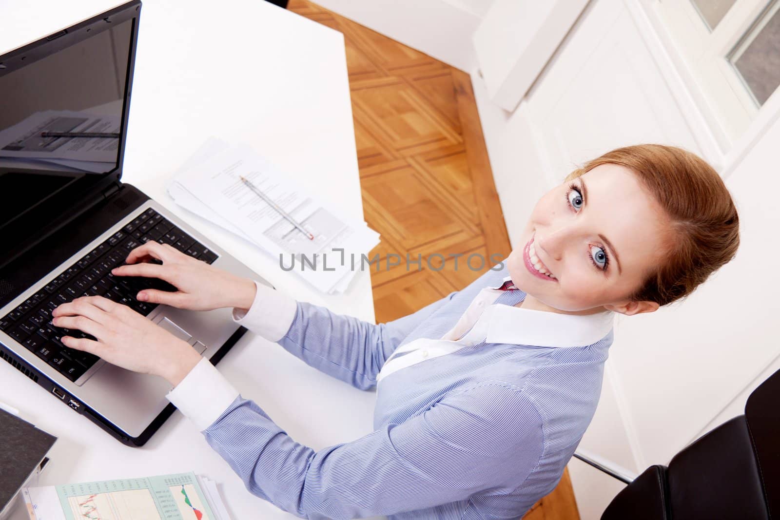 young successful business woman working on computer in office