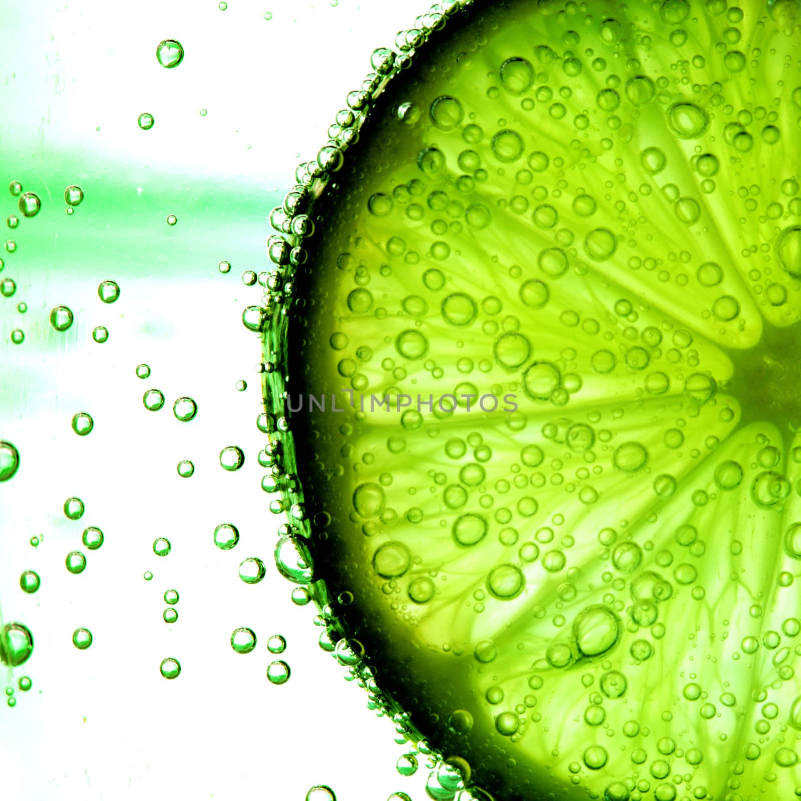 lime slice in water bubbles