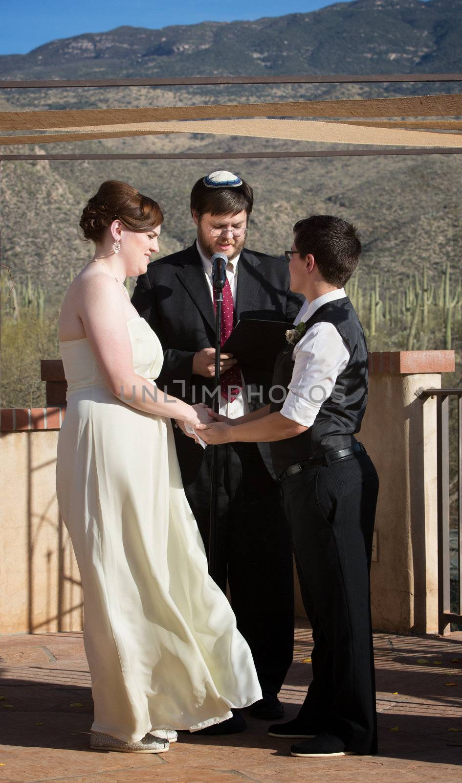 Rabbi blessing lesbian marriage ceremony in desert