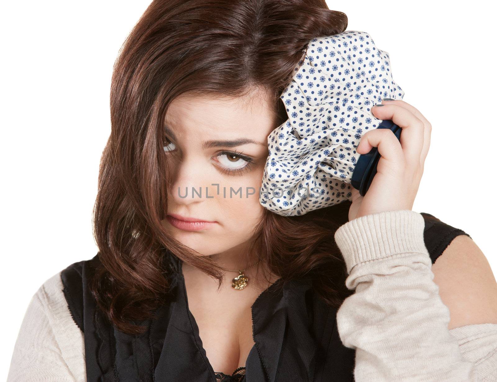 Isolated brunette female with ice pack on head