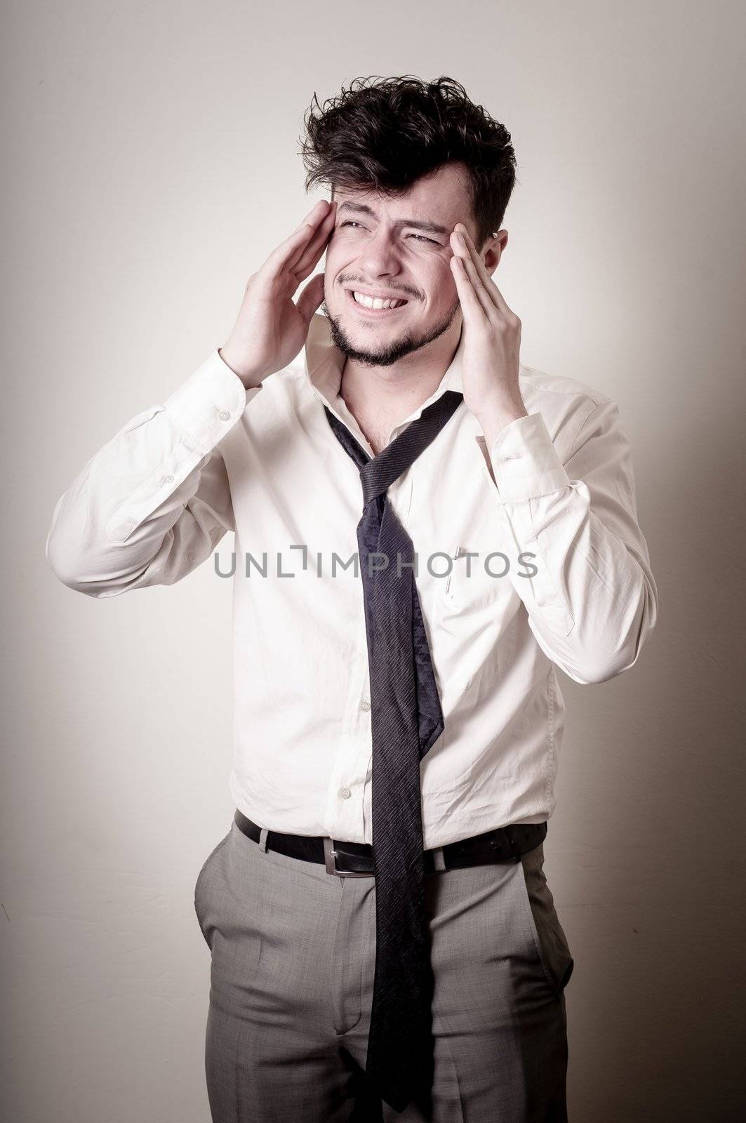 stressed businessman on gray background