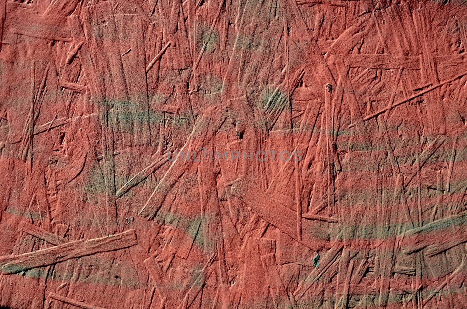 grunge red painted chipboard closeup background by sauletas